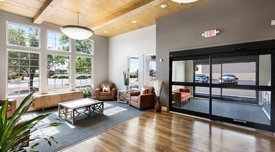 Interior common area with seating and large windows