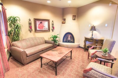 Cozy lounge area with a fireplace and seating