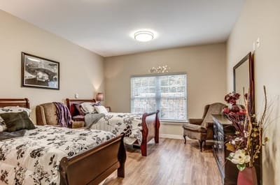 Cozy shared resident room with two beds and decor