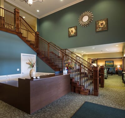 Lobby area with staircase and seating