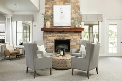 Common area with seating around a fireplace
