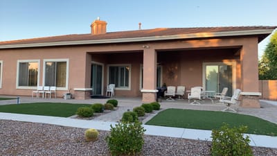Exterior view of the care home with outdoor seating