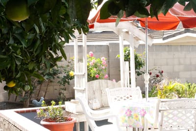 Outdoor seating area with flowers and gazebo