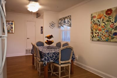 Bright dining room with floral decor and table