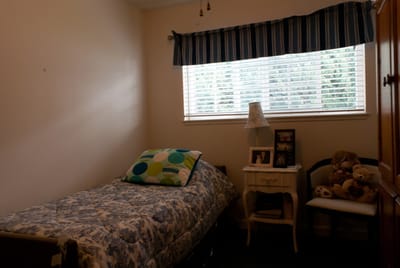 Cozy resident room with a bed and window