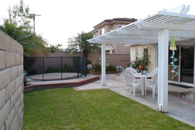 Outdoors space with a table and chairs in a garden