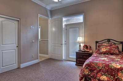 Cozy bedroom with floral bedding and natural light
