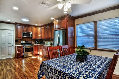 Bright kitchen with wooden cabinets and dining table