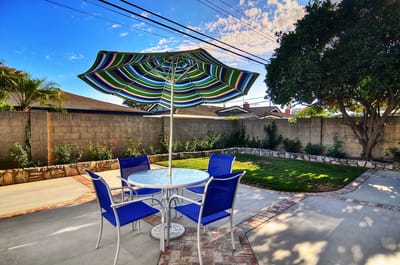 Outdoor seating area with a patio umbrella and chairs