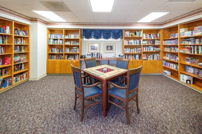 A cozy library space with bookshelves and seating