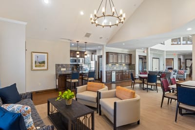 Bright common area with seating and dining space