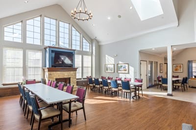 Bright common area with large windows and seating
