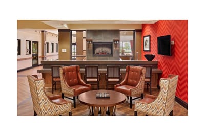 Common area with armchairs and a fireplace
