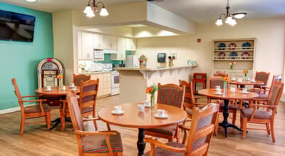 A bright dining area with tables and chairs