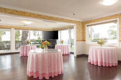 Brightly decorated common area with floral tables