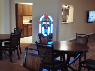 Common area with a jukebox and tables