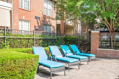 Lounge chairs by the poolside at Preston Place