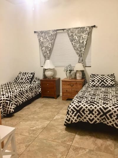 A shared resident room with twin beds and decor
