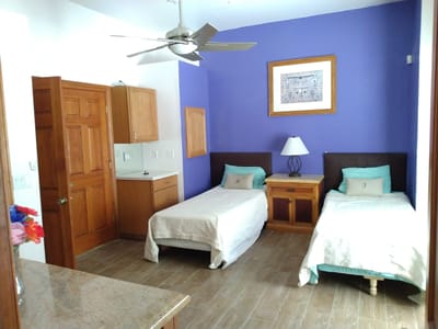 A well-furnished private resident room with two beds