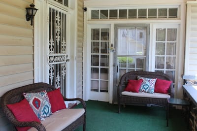 Lounge area with wicker chairs and decorative pillows