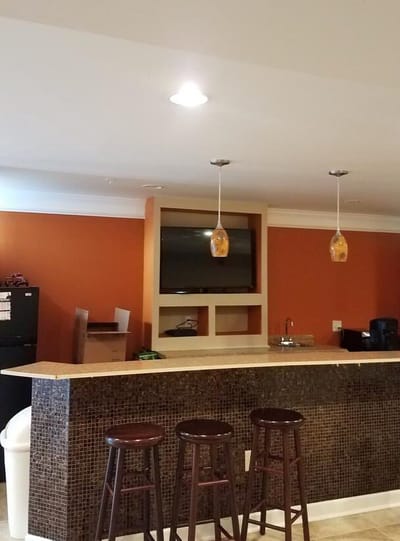 Bright and inviting common area with a bar and TV