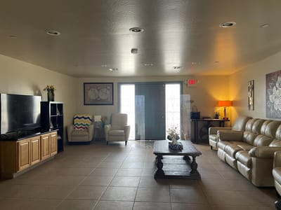 Bright common area with seating and natural light