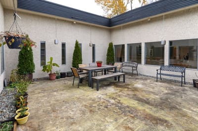 Outdoor patio area with seating and plants