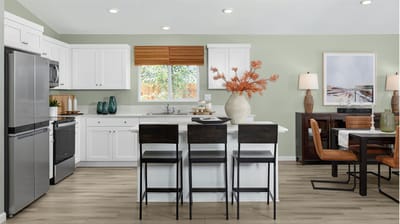 Modern kitchen area with seating and decor