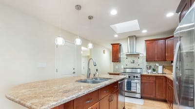 Modern kitchen with wooden cabinets and appliances