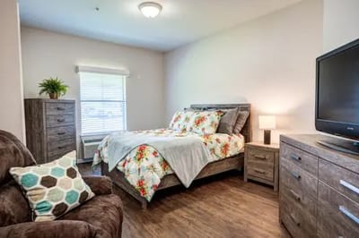 Cozy private resident room with floral bedding