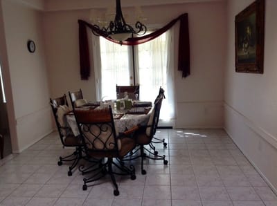 Dining room with a large table and chandelier