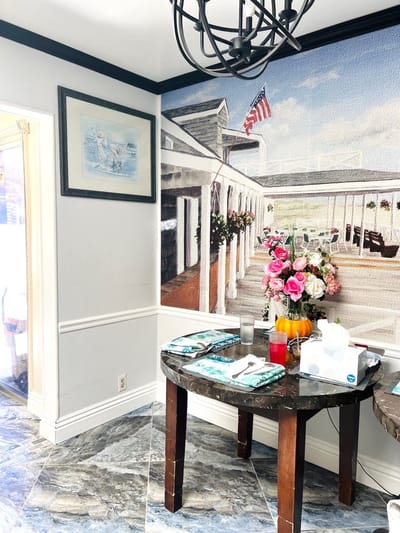 Interior corner of a bright common area with floral decor