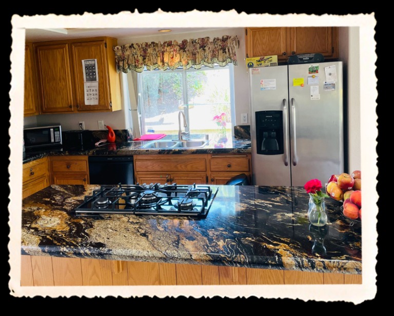 A kitchen interior with modern appliances and decor