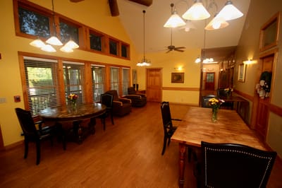 Bright and welcoming common area with tables and seating