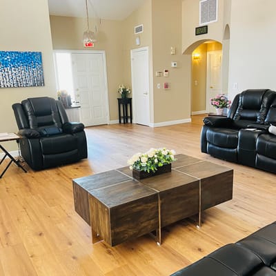 Shared common area with seating and decorative flowers