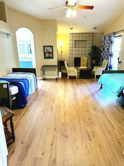 Bright interior of a shared resident room with beds