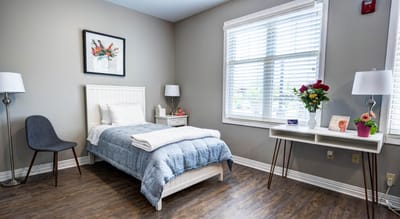 Cozy interior of a resident's room with a bed and decor