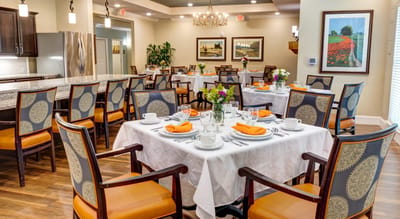 Dining area set up for a meal with flowers