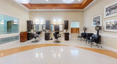Brightly lit salon area with styling chairs