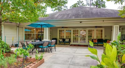 Outdoor seating area with tables and umbrellas