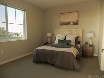 A well-furnished bedroom in a senior living facility