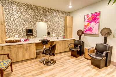 Beauty salon interior with styling chairs and decor