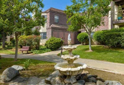 Outdoor courtyard with a fountain and seating