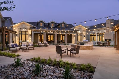 Outdoor courtyard area with seating and string lights