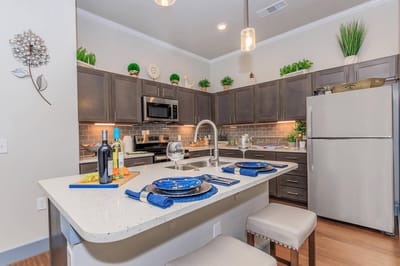 Modern kitchen with dining setup in a senior living facility
