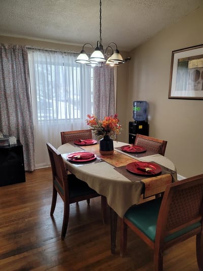 Dining room set for a meal with decorations