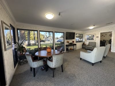 Bright common area with seating and dining table