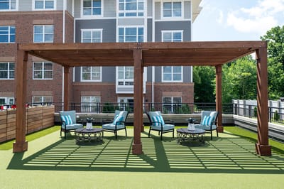 Outdoor seating area with pergola and furniture