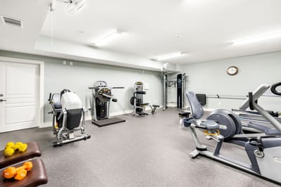 A fitness room with exercise equipment