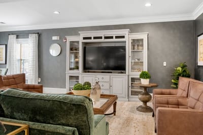 Cozy common area with seating and entertainment center